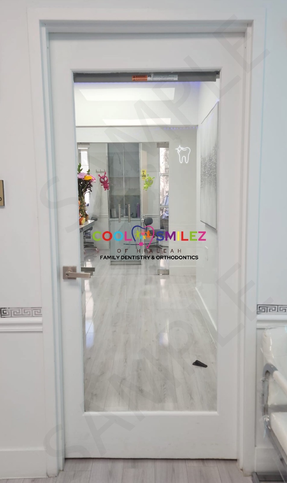 Cool Smilez of Hialeah branded glass door entrance